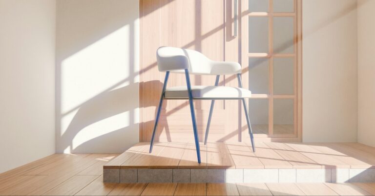 A single white chair in warm sunlight on a wooden floor by a glass door